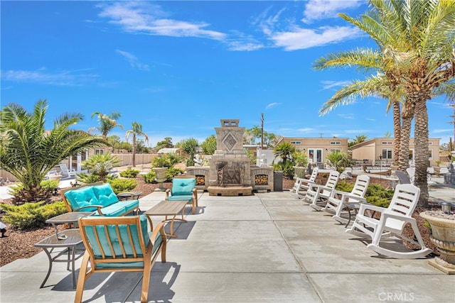 view of patio / terrace with an outdoor stone fireplace