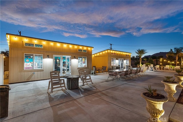 patio terrace at dusk with french doors