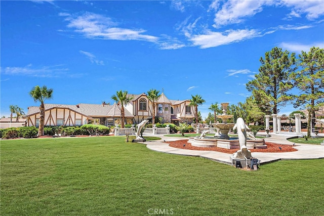 view of home's community featuring a lawn