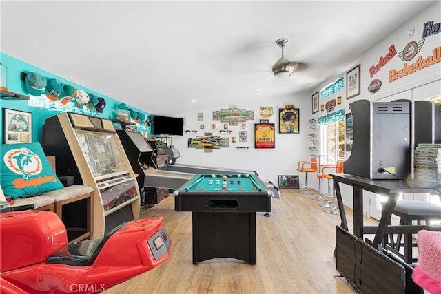 rec room with light wood-type flooring, pool table, ceiling fan, and vaulted ceiling