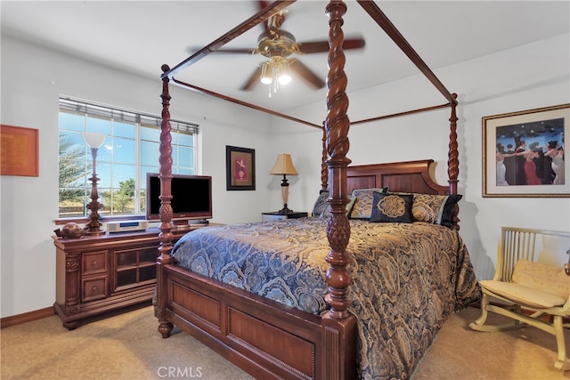 bedroom featuring light carpet and ceiling fan