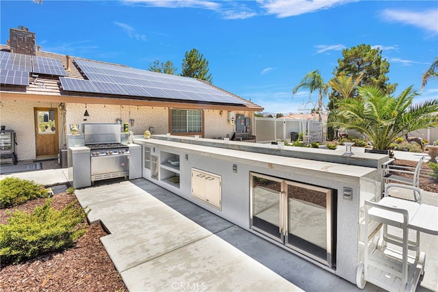 view of patio / terrace with an outdoor kitchen