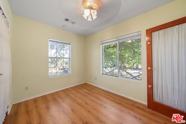 foyer entrance with ceiling fan and light hardwood / wood-style floors