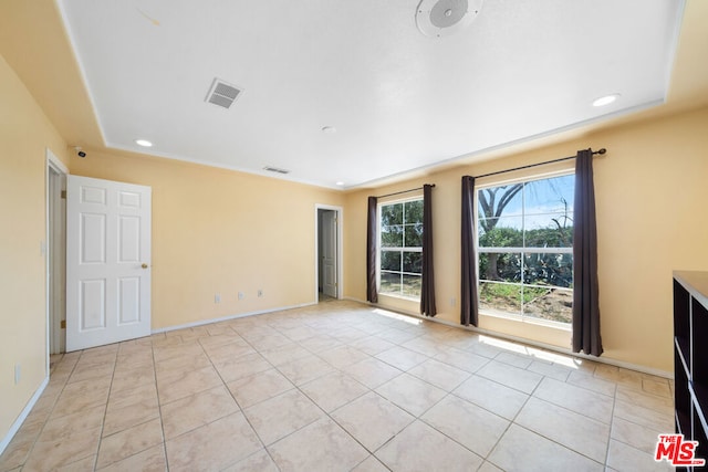 empty room featuring light tile patterned floors