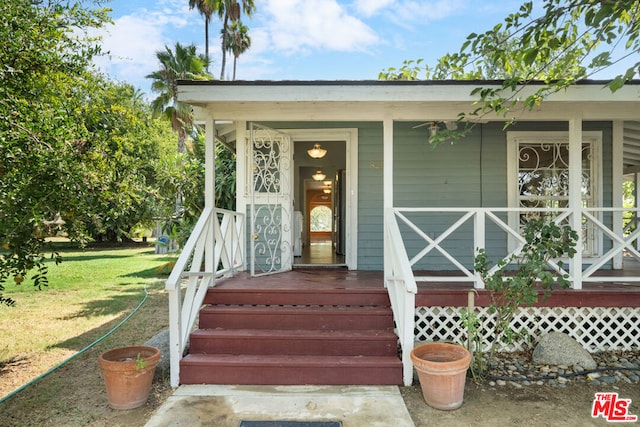 entrance to property with a porch