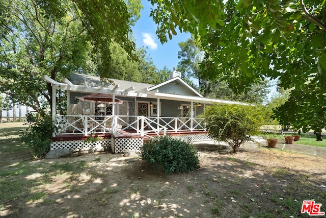 back of house featuring covered porch