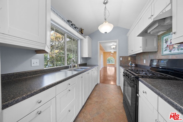 kitchen with black gas range, white cabinetry, sink, tasteful backsplash, and lofted ceiling