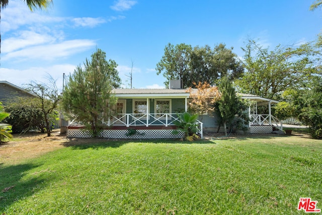 view of front of house with a porch and a front yard