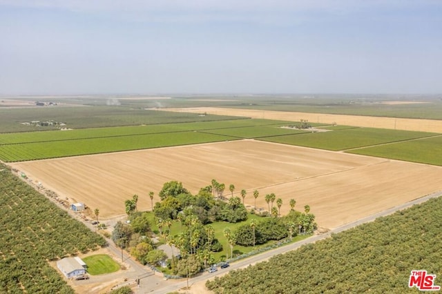 birds eye view of property with a rural view