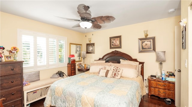 bedroom with dark wood-type flooring and ceiling fan