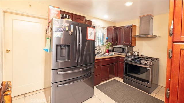 kitchen with stainless steel appliances, light tile patterned floors, and extractor fan