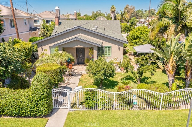 bungalow-style home featuring a front yard