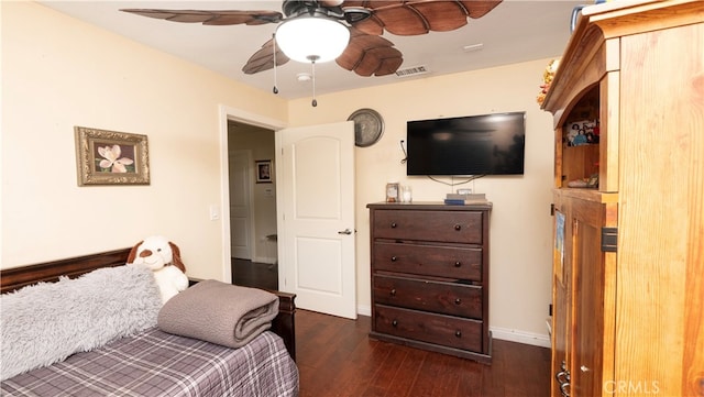 bedroom featuring ceiling fan and dark hardwood / wood-style flooring