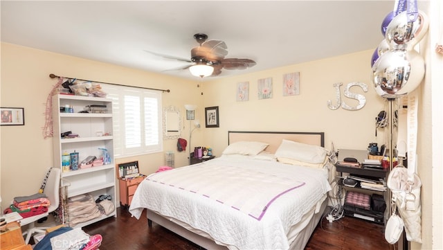 bedroom featuring ceiling fan and dark hardwood / wood-style floors