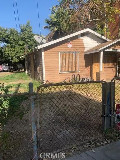 view of gate with fence