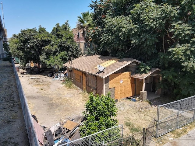 view of property exterior with a gate and fence