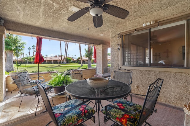 exterior space with ceiling fan