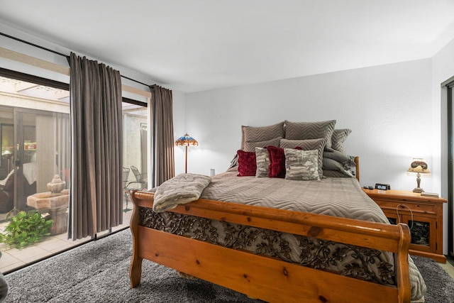 bedroom featuring carpet and access to exterior