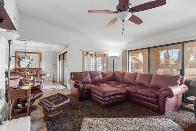 living room with lofted ceiling and ceiling fan