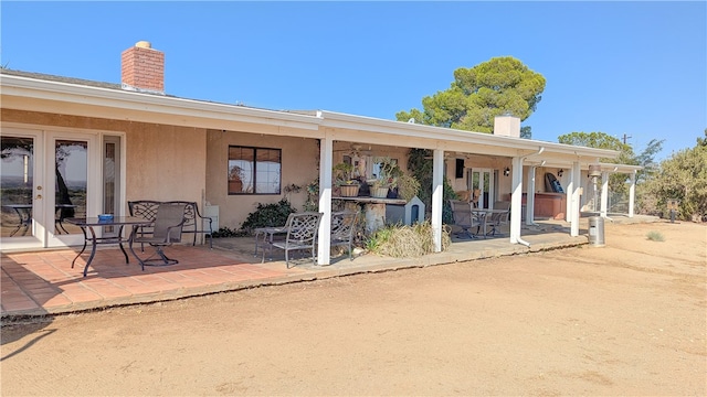 rear view of house with a patio