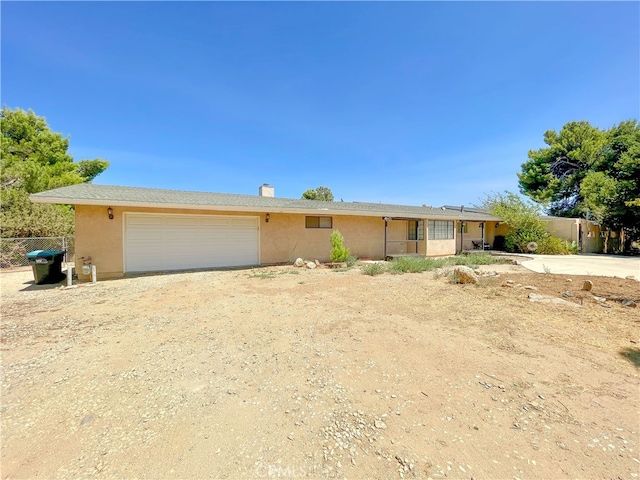 single story home with a garage