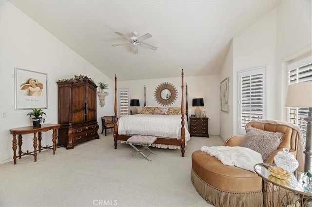 carpeted bedroom with high vaulted ceiling and ceiling fan