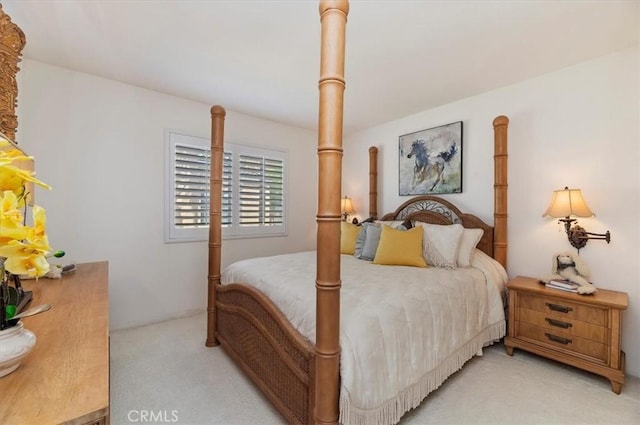 bedroom featuring light carpet