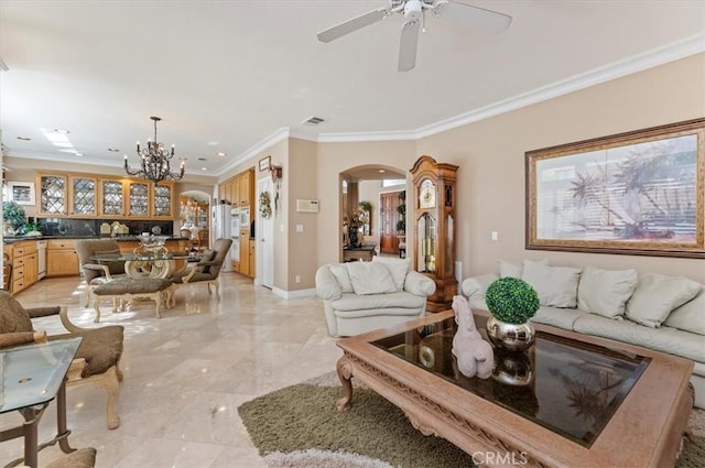 living room with ceiling fan with notable chandelier and ornamental molding