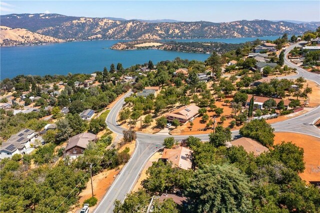 aerial view featuring a water and mountain view