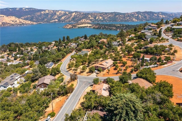 drone / aerial view featuring a residential view and a water and mountain view