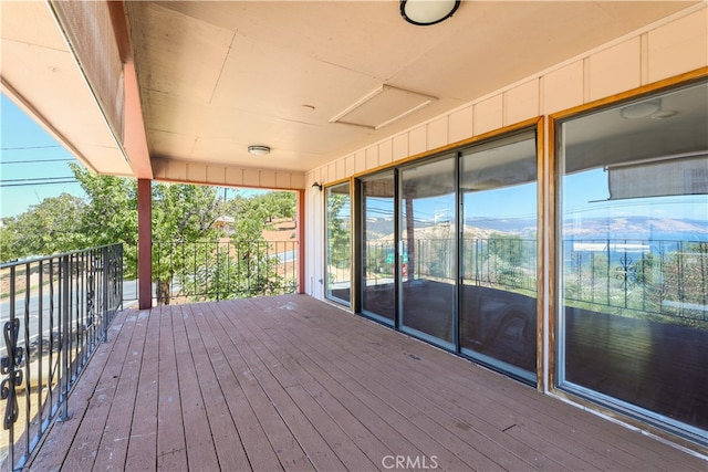 wooden deck featuring a mountain view