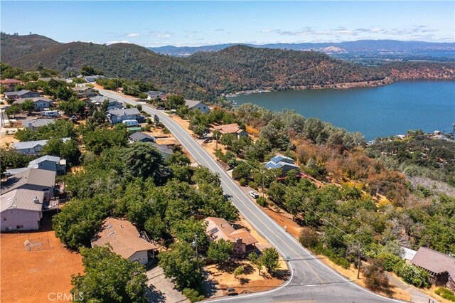 aerial view featuring a water and mountain view