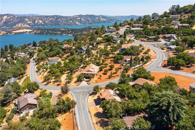 bird's eye view with a water and mountain view