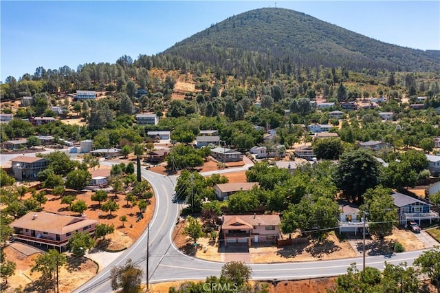 birds eye view of property with a residential view and a mountain view