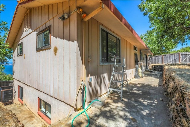 view of property exterior with fence