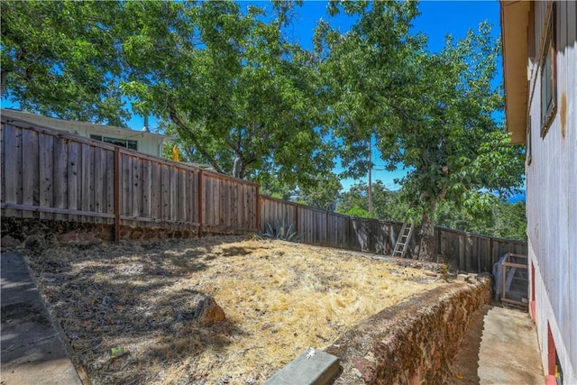 view of yard with a fenced backyard