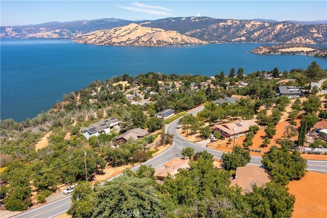 bird's eye view featuring a water and mountain view