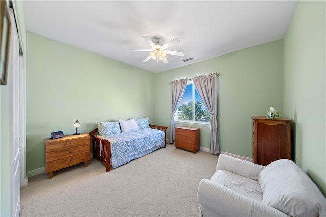 carpeted bedroom featuring ceiling fan