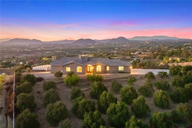 aerial view at dusk with a mountain view