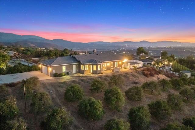 exterior space featuring a garage and a mountain view