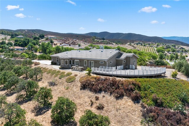 back of house with a mountain view