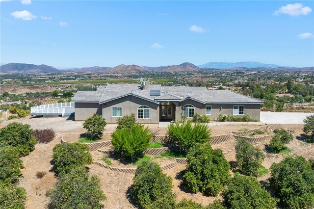 view of front of property with a mountain view