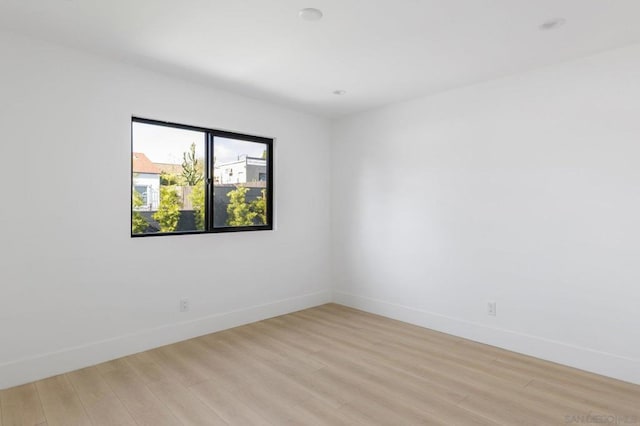 unfurnished room with light hardwood / wood-style flooring