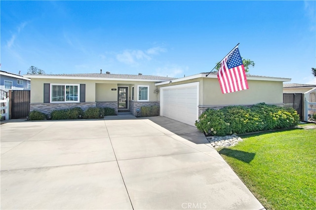 view of front of home featuring a front lawn and a garage