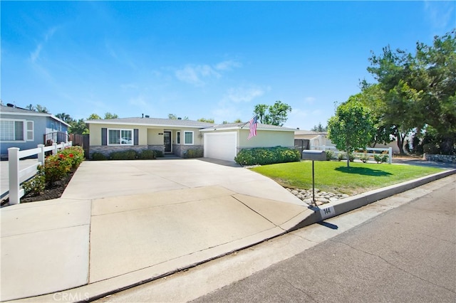 ranch-style house with a front lawn and a garage