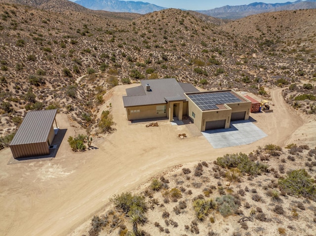 drone / aerial view featuring a mountain view