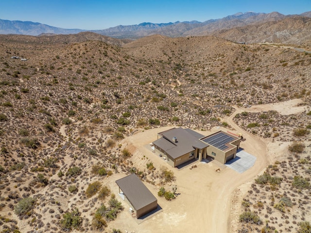 birds eye view of property with a mountain view