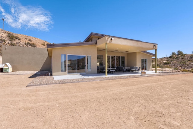 back of property featuring a patio