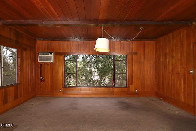 spare room with wood ceiling, plenty of natural light, a wall mounted air conditioner, and carpet