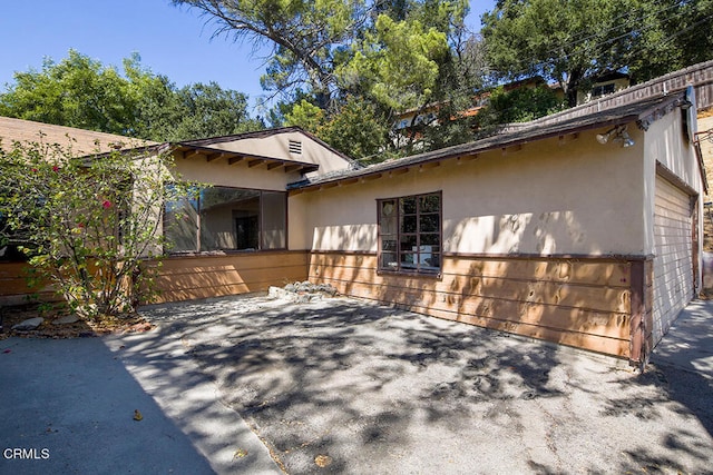 exterior space with a garage